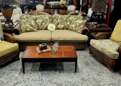 Cozy living room with a beige sofa and wooden coffee table.