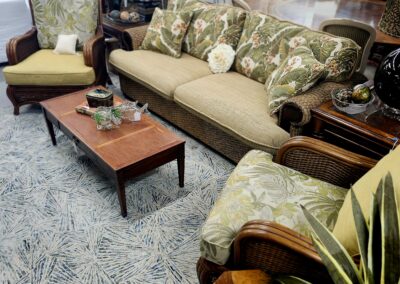 Cozy living room setup with floral sofa and wooden coffee table.