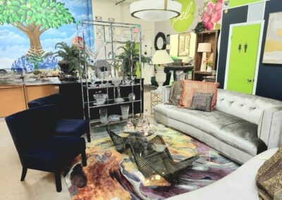 Eclectic living room with mixed furniture and vibrant decor.
