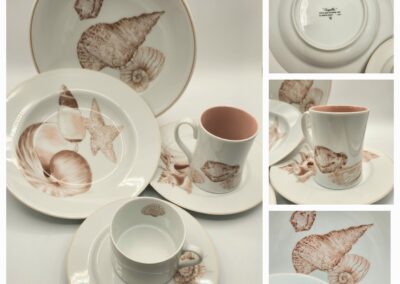 Porcelain set with bird motifs including plates, cups, and saucers.