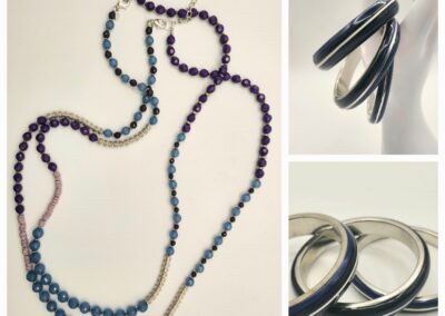 Elegant beaded necklace and black hoop earrings on display.