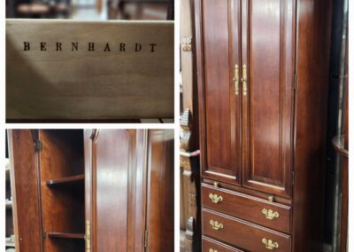 Tall wooden cabinet with drawers and shelves in a restaurant setting.