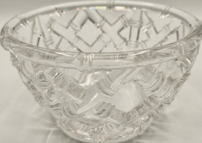 Clear glass bowl with intricate geometric patterns.