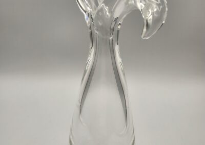 Elegant clear glass vase with unique curved handles.