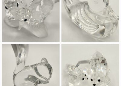 Four elegant crystal animal figurines displayed in a grid.