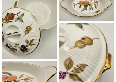 Elegant vintage porcelain dish with floral and fruit motifs and gold accents.