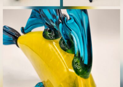 Colorful glass sculpture with blue and yellow elements.