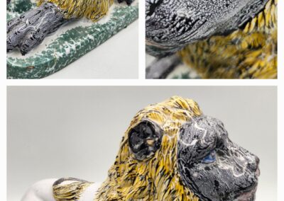 Close-up views of a detailed, weathered dinosaur sculpture.