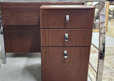Wooden office drawer unit with three lockable compartments on wheels.