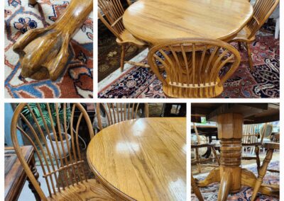 Vintage wooden dining set with round table and spindle-back chairs on patterned rug.