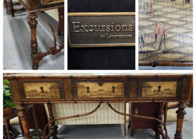 Antique wooden desk with intricate carvings and multiple drawers.