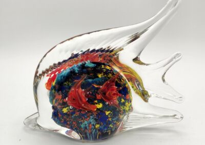 Colorful glass fish sculpture with vibrant internal patterns.