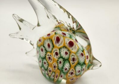 Colorful glass fish sculpture with intricate patterns.