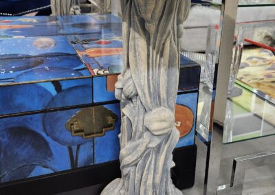 Decorative pedestal with a seashell and starfish design.