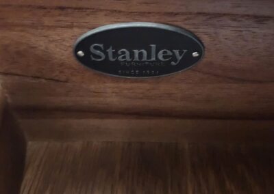 Close-up of a Stanley-branded wooden tool or brush holder.
