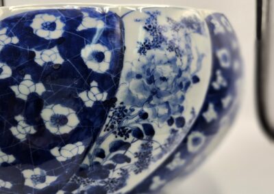 Close-up of a blue and white patterned ceramic bowl with floral designs.