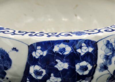 Close-up of a blue and white ceramic bowl with floral patterns.