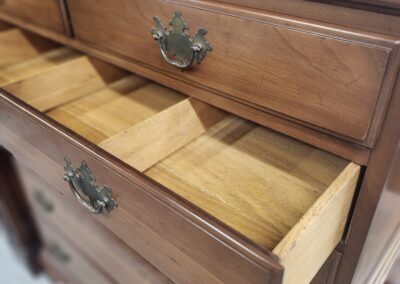 Open wooden drawer in classic style chest.