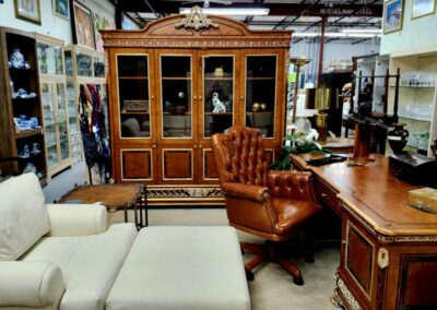Elegant vintage wooden cabinet with leather armchair in a cozy room.