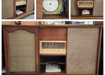 Vintage wooden radio cabinet with speaker grills and control knobs.