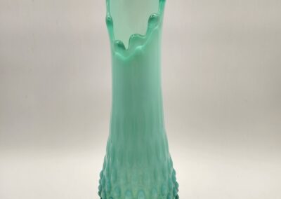 Tall green frosted glass vase with textured hobnail design.