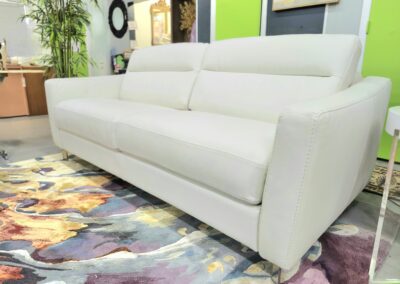 Modern white sofa with clean lines in a bright room.
