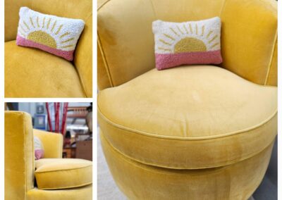 Round yellow velvet chair with decorative pillow in a cozy setting.