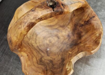 Hand-carved wooden bowl with natural grain patterns.