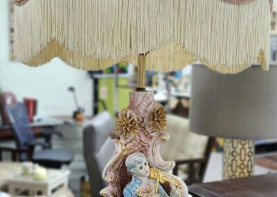 Vintage lamp with a ceramic mother and child figurine base.
