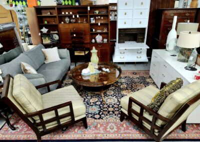 Cozy living room with wooden furniture and patterned rug.