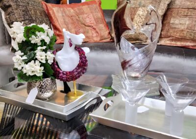 Elegant glassware and festive decor on a coffee table.