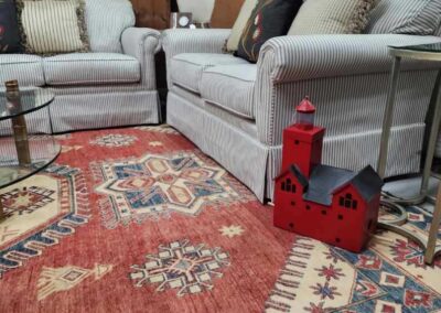 Cozy living room with gray sofas and a decorative red lantern.