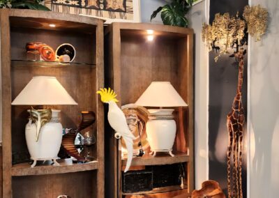 Cozy corner with warm lighting, decorative lamps, and rustic wooden shelves.