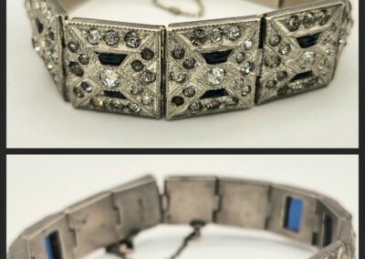 Vintage silver bracelet with intricate black and blue stone inlays.