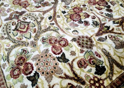 Intricate floral and paisley motifs on a richly detailed carpet.