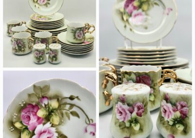 Elegant floral porcelain dinnerware set with pink roses and green leaves.