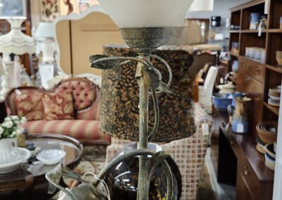 A close-up of a coffee grinder filled with coffee beans in a cozy shop.