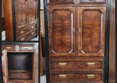 Antique wooden wardrobe with mirror and drawers, showcasing rich wood grain and brass handles.