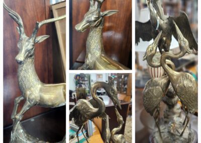 Intricately crafted brass deer sculpture with detailed antlers and base.