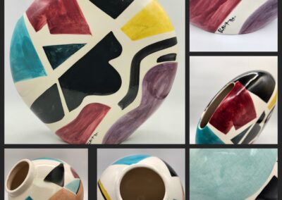 Colorful abstract ceramic plate and cup set with artistic designs.