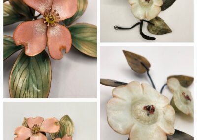 Close-up of decorative ceramic flower sculptures in soft peach and cream tones.