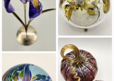 Four artistic glass spheres with intricate designs and vibrant colors.