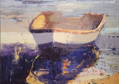 A small boat resting on calm water with reflections at sunset.