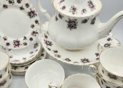 Floral-patterned porcelain tea set with teapot.