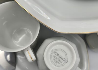 White porcelain dishes with gold trim.