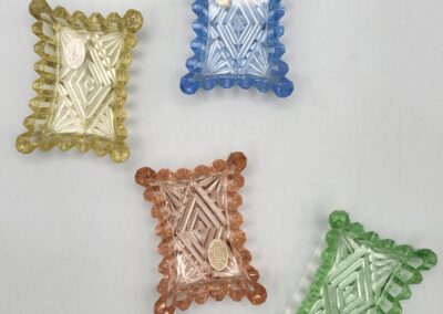 Colorful glass trays with decorative patterns.