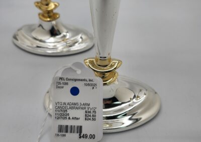 Silver candelabra with price tag attached.