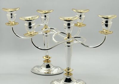 Silver and gold candle holders, three branches.