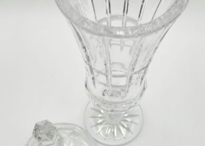 Crystal vase with detachable lid on display.