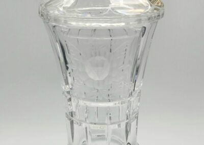 Crystal glass trophy with ornate lid.